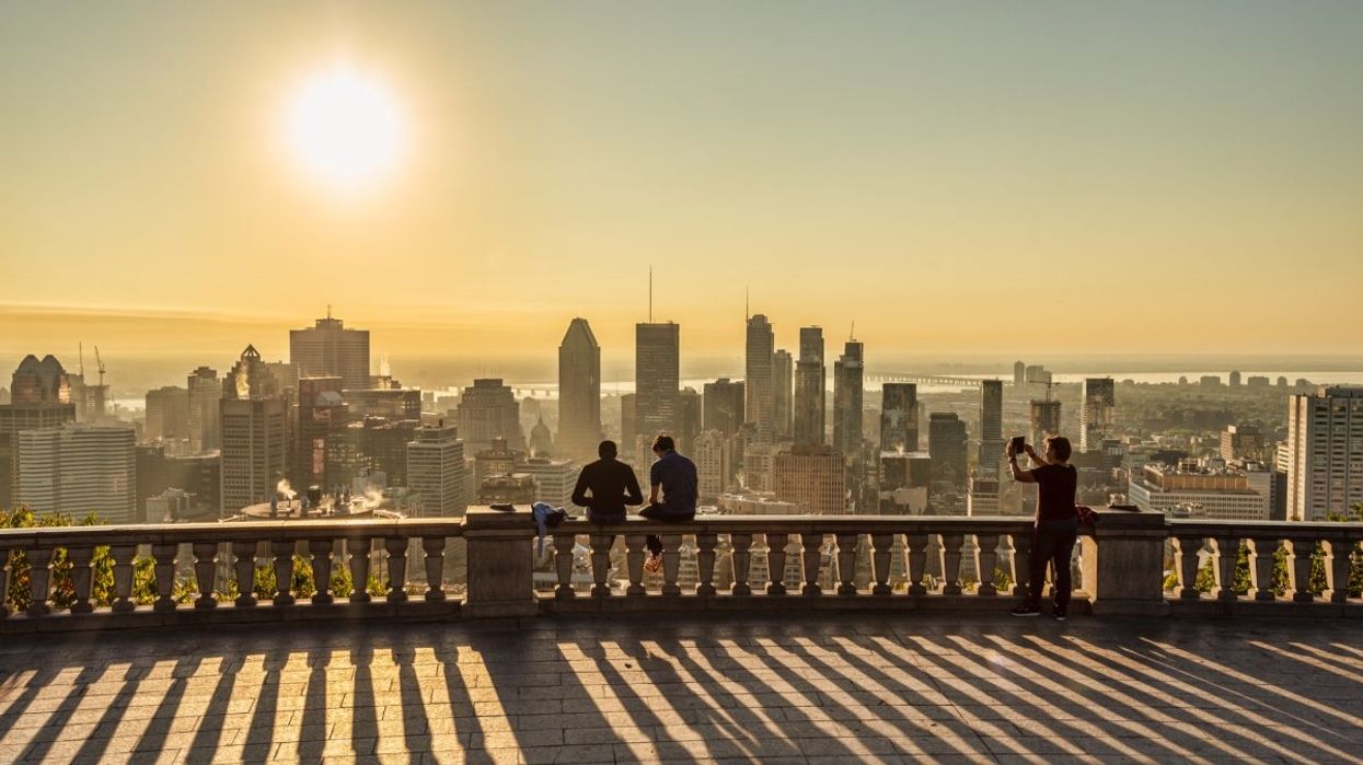 The sun beaming across the city skyline of Montreal during the summer. 