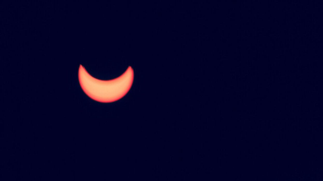 The sun being covered by the moon.