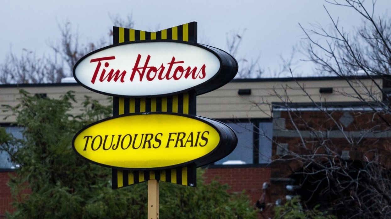The Tim Hortons sign followed by the restaurant's slogan in French.