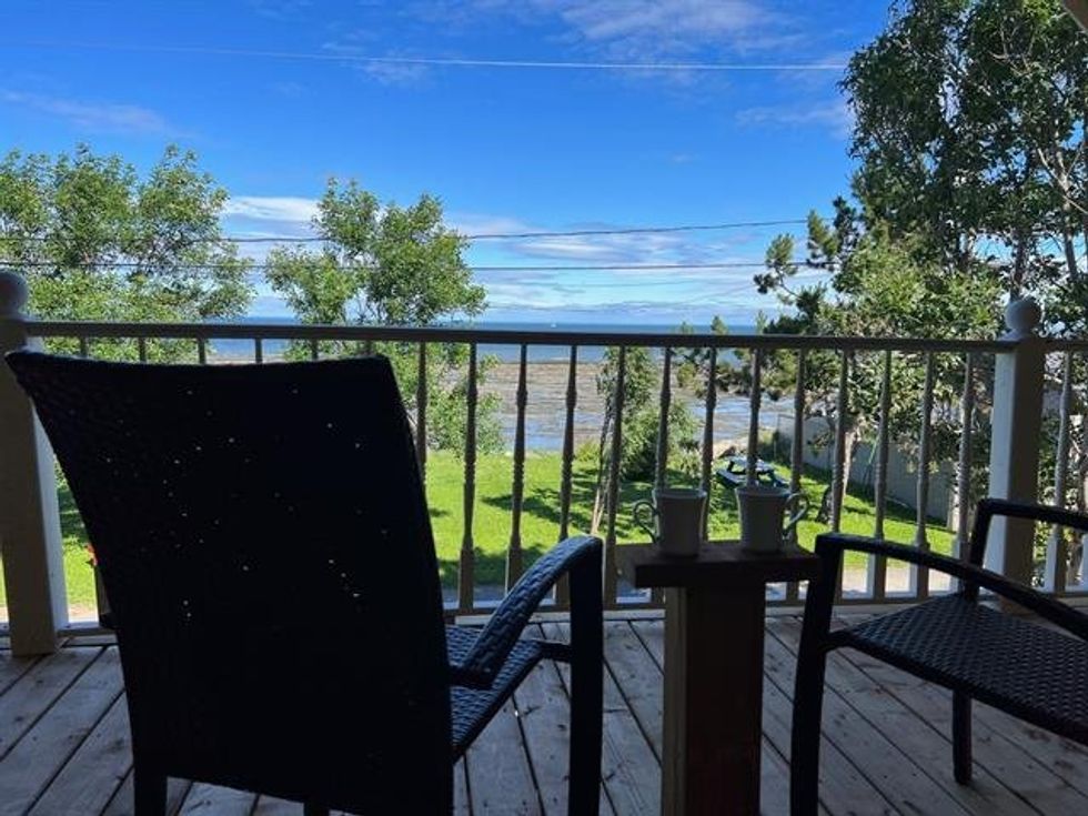 The view fromt he uper balcony of 91, route Langlois.