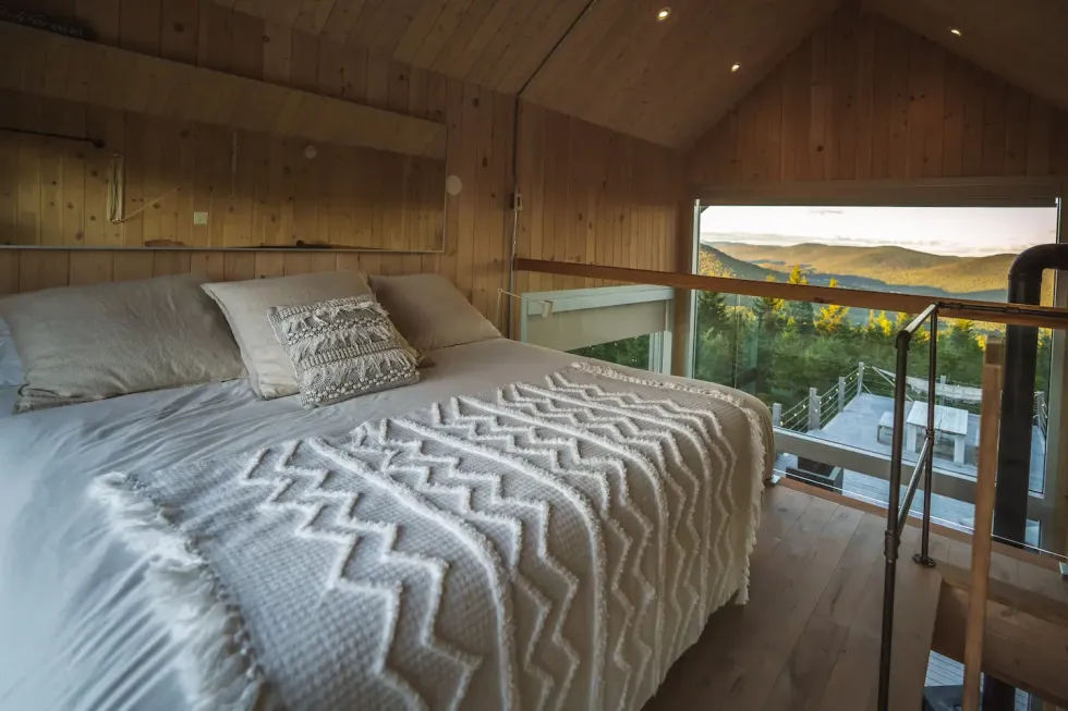 The view of surrounding mountains from the bed.