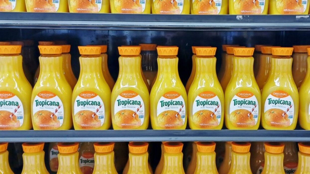 Tropicana juice on a grocery store shelf.