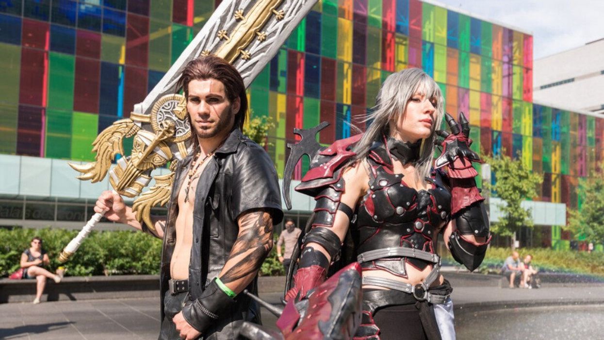 Two cosplayers pose outside Montreal's Palais des Congrès.