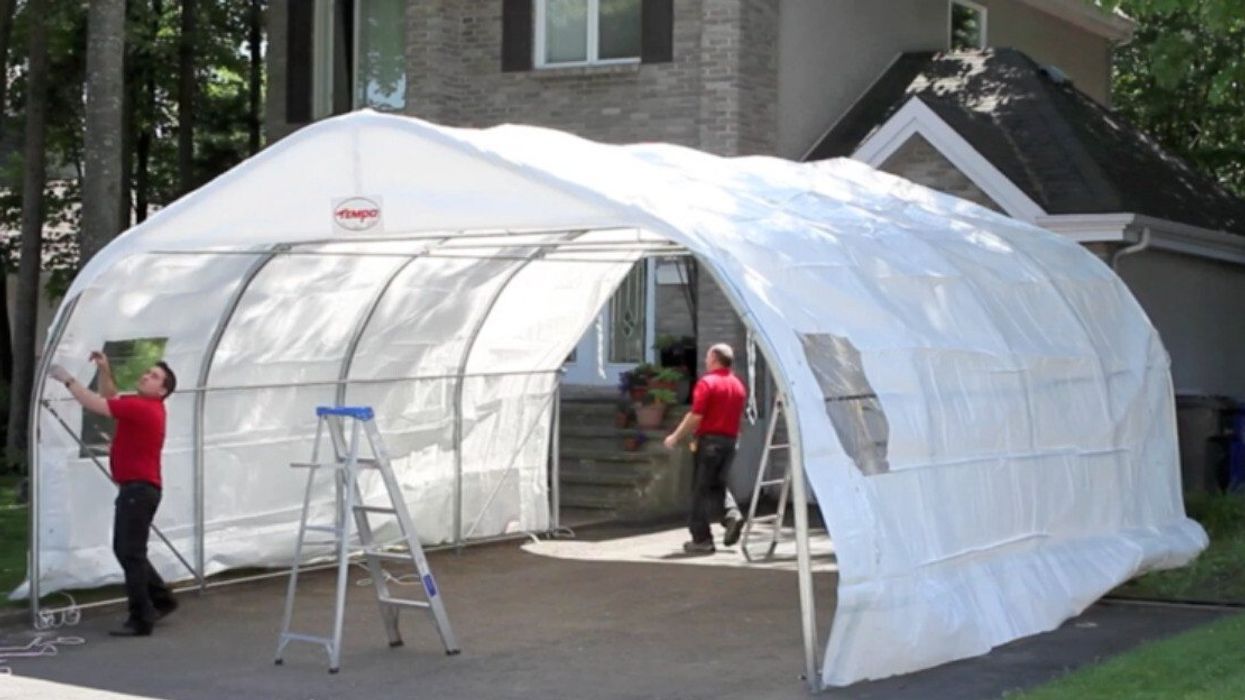 Two men install a Tempo shelter in Quebec.