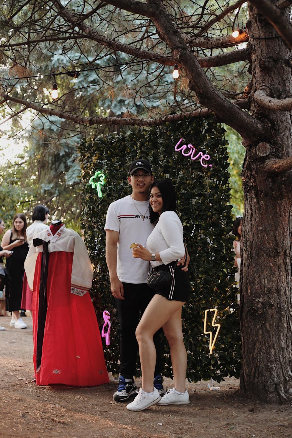 Two people pose for a photo at a previous edition of POCHA MTL.