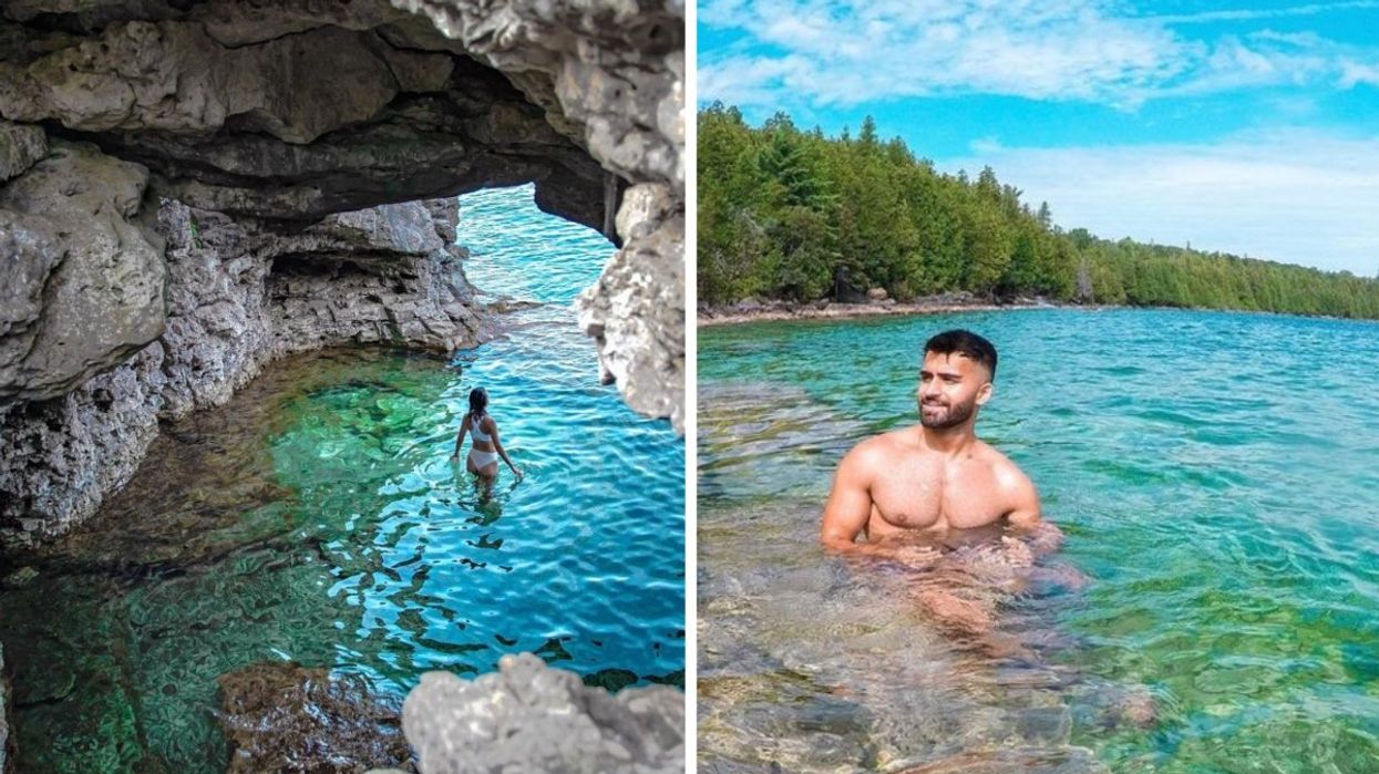 Two people swimming in the crystal-clear waters of Bruce Peninsula National Park.