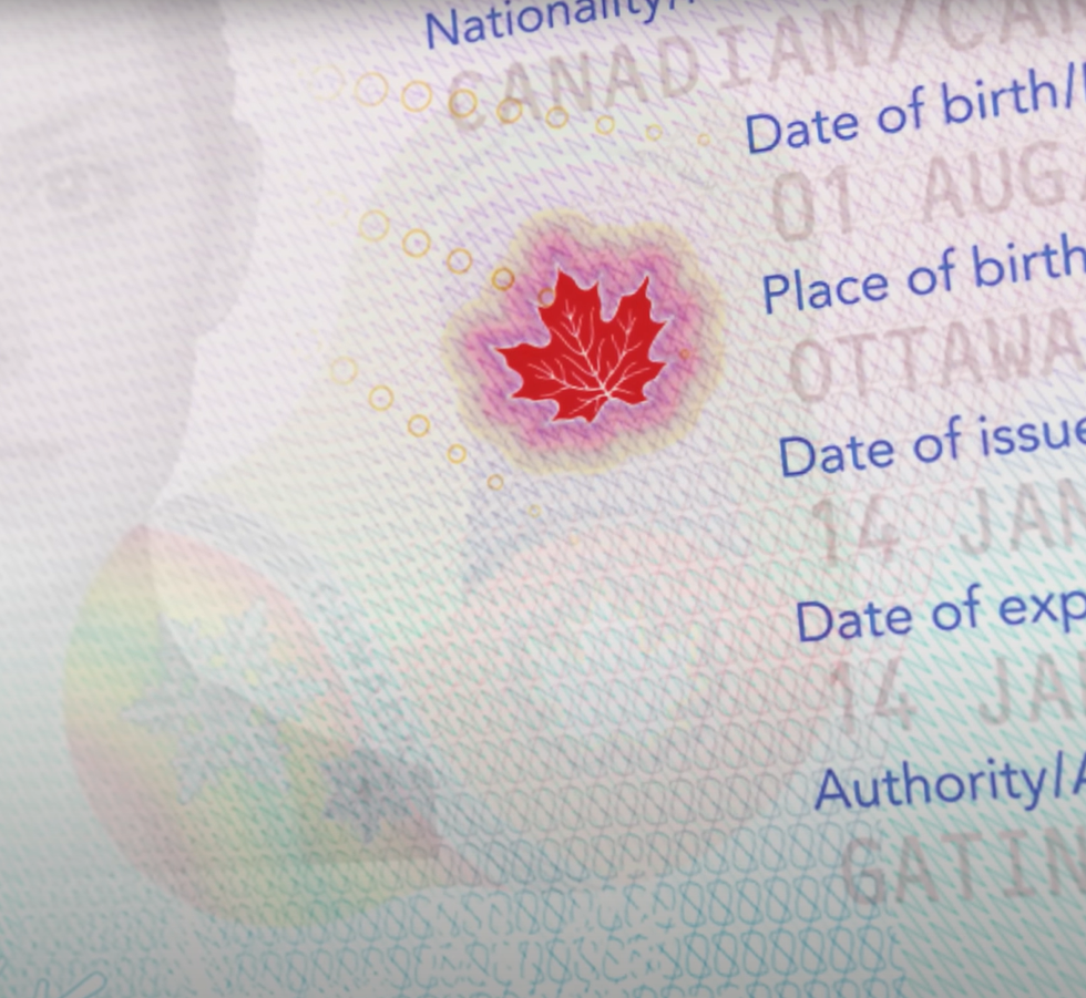 \u200b\u200bA sample photo of the disappearing maple leaf found on all Canadian passport ID pages.