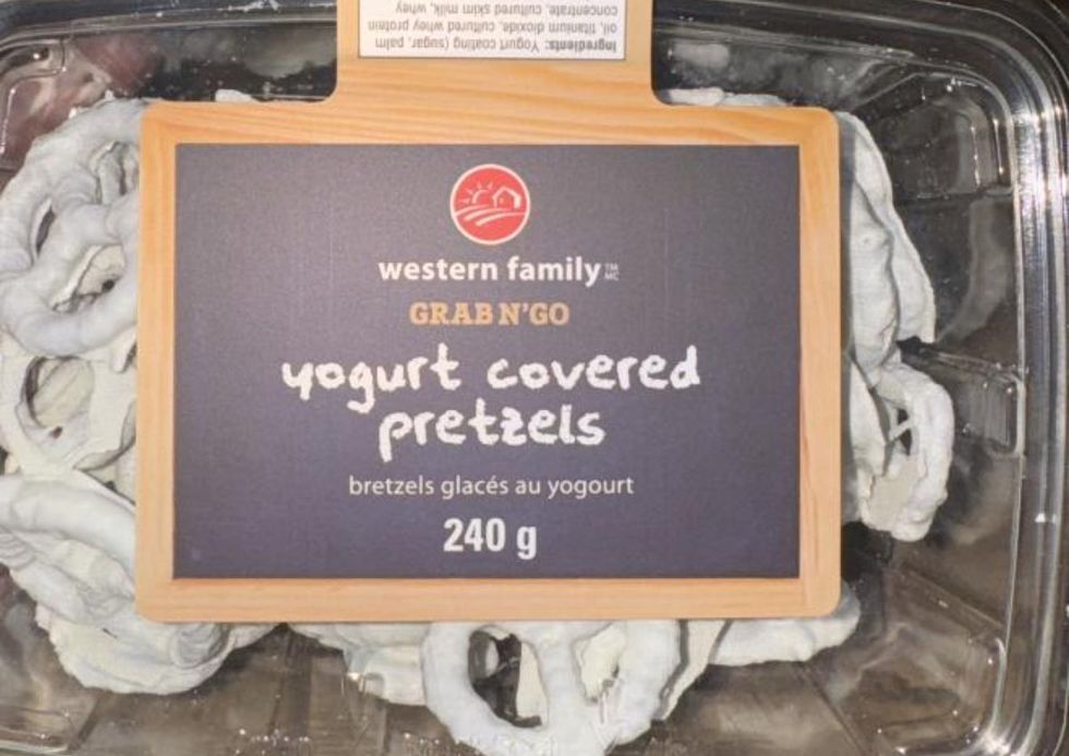 \u200bA box of yogurt covered pretzels inside a plastic box with the label on the front.