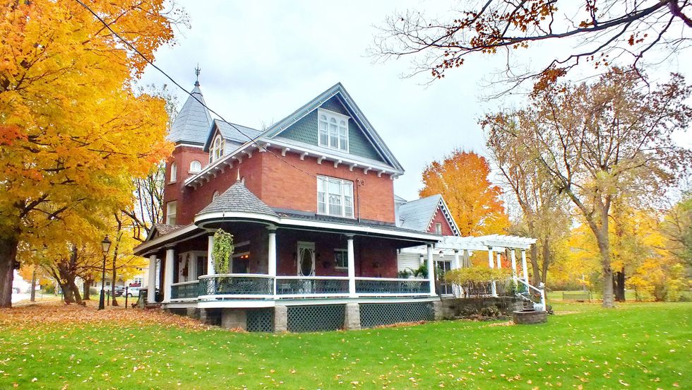 \u200bA historic home in the fall in Merrickville, Ontario.