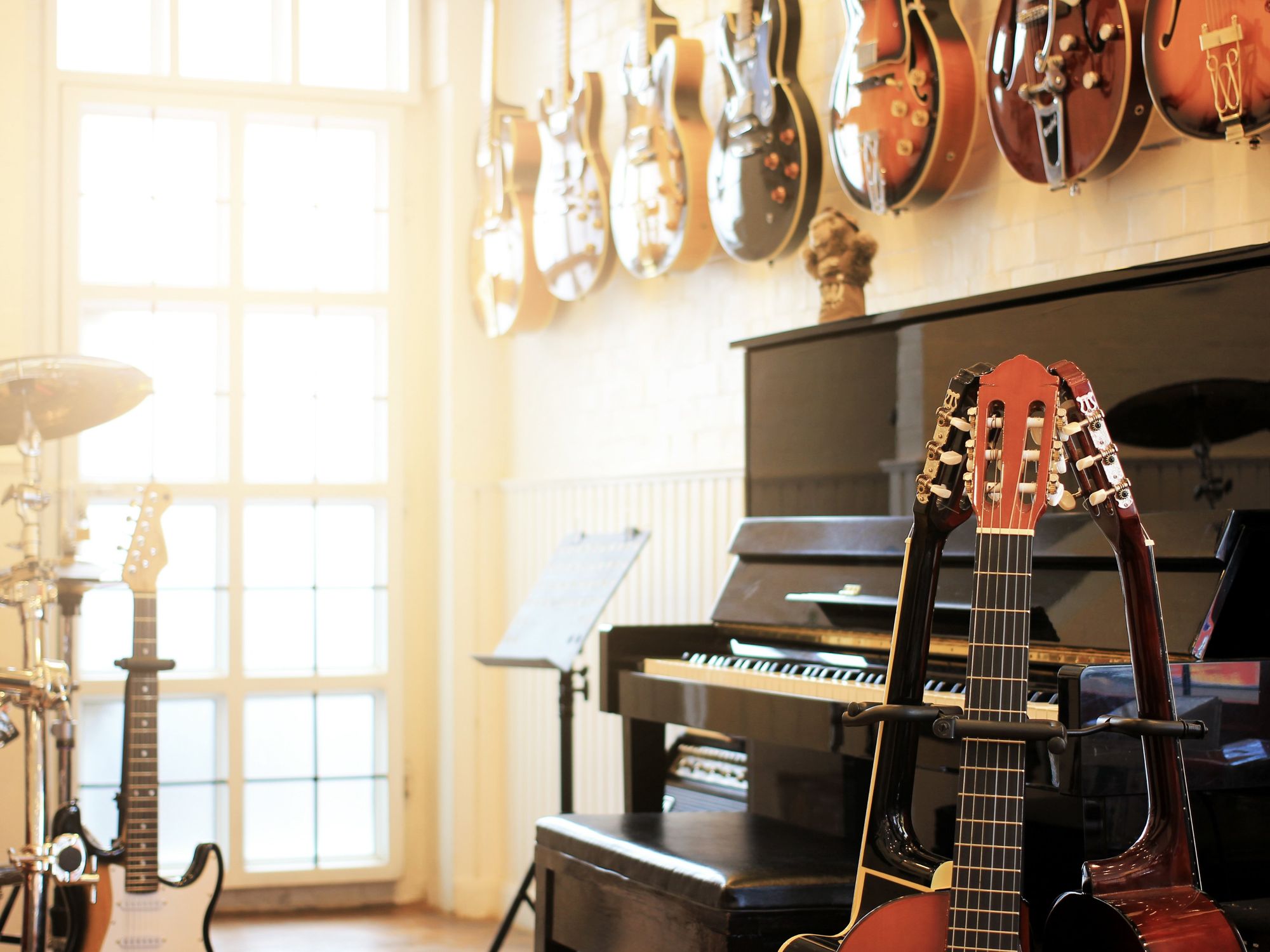 \u200bA selection of guitars and a piano.
