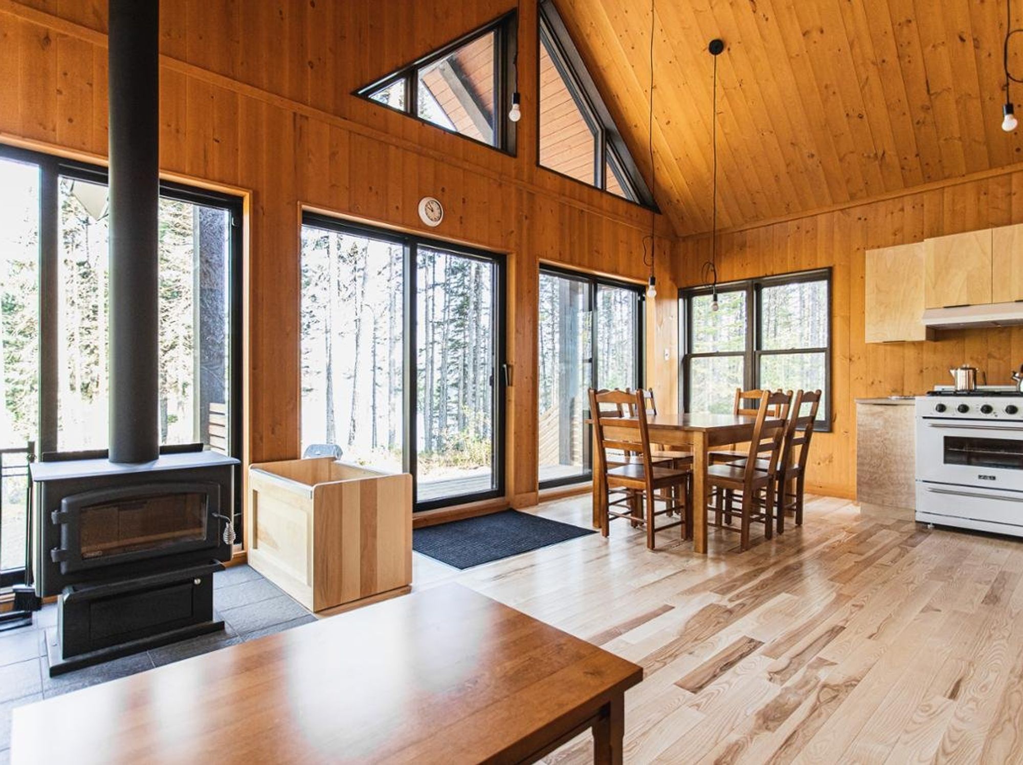 \u200bA spacious chalet with a wood-lined interior and ample natural light.