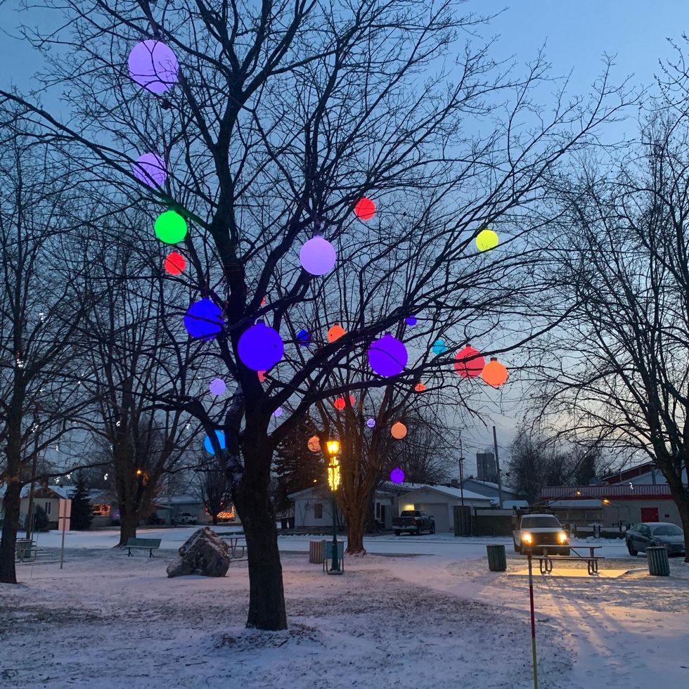 \u200bA tree in Saint-Pie decorated with illuminated spheres.