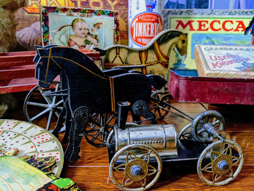\u200bAntique toys, like a horse and steam engine.