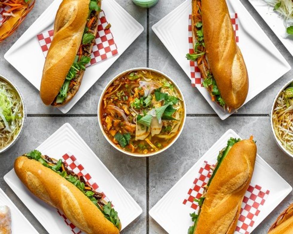 \u200bB\u00e1nh m\u00ec sandwiches and soup on a tiled surface.