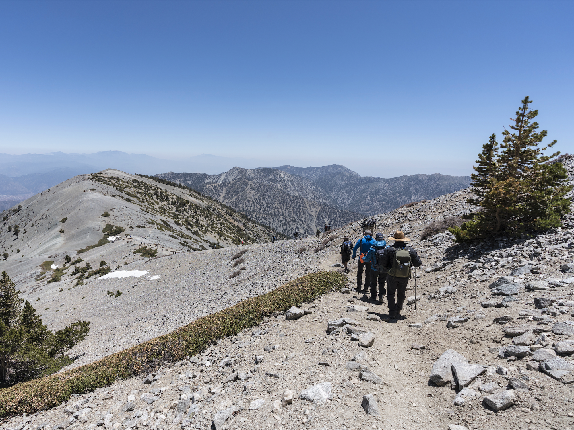 \u200bHikers on the popular Devil's Backbone trail near the summit of Mt Baldy.