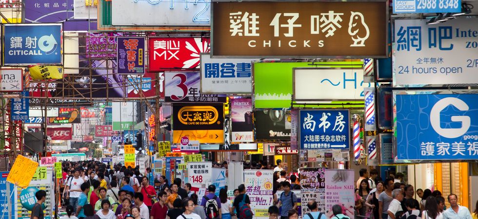 \u200bHong Kong street at night with lots of signs and people