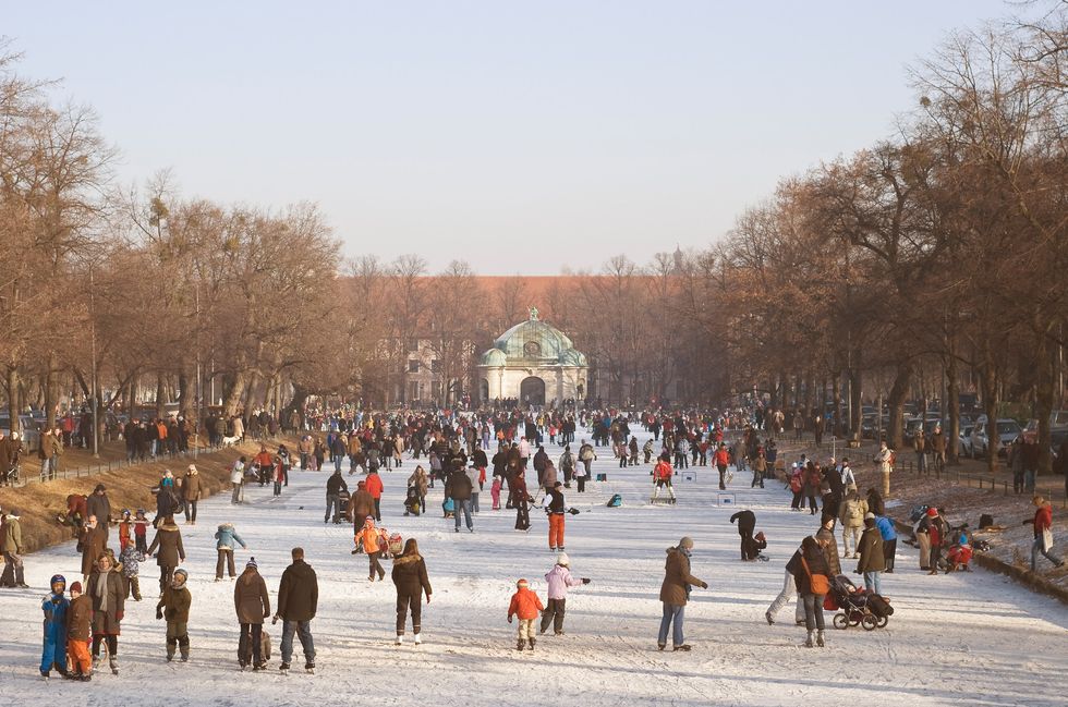 \u200bIce skating and curling on the Nymphenburg Palace Canal in Munich, Germany.