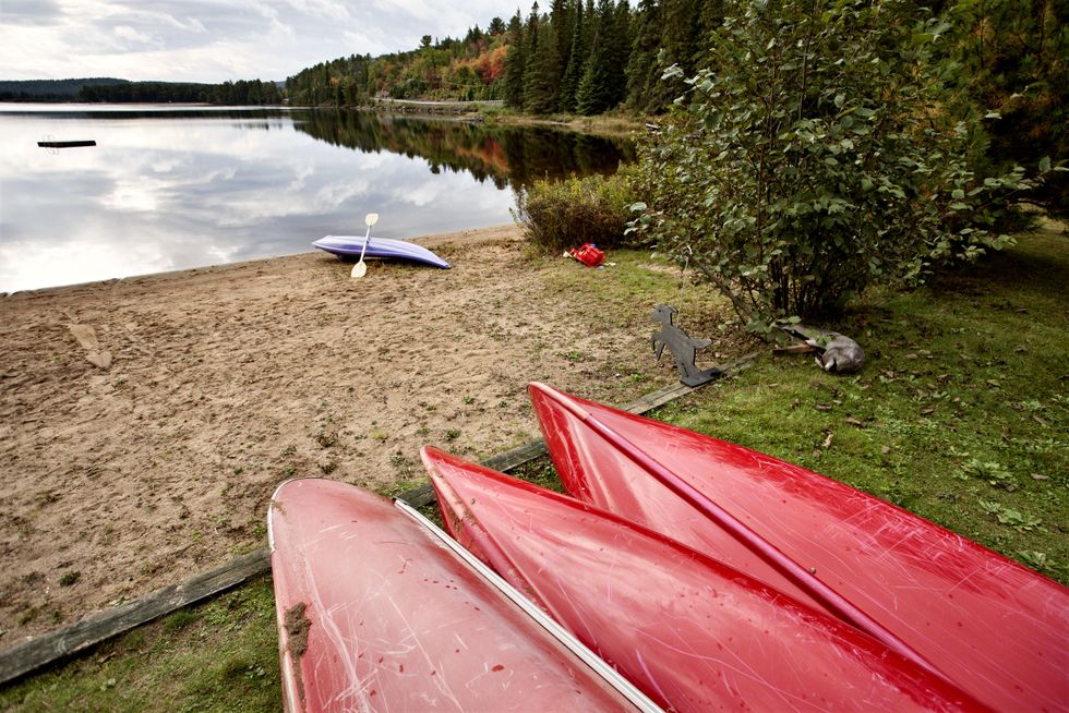 \u200bKayaks on a beach at Algonquin Park Muskoka Ontario Lake Wilderness.