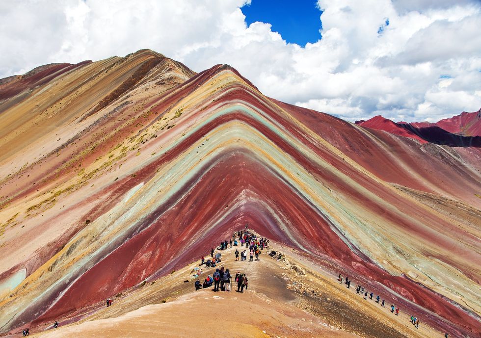 \u200bPeople at Rainbow Mountain in Peru.