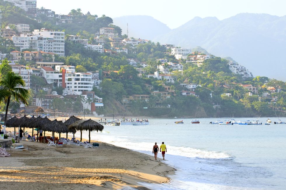 \u200bPeople on the beach in Puerto Vallerta, Mexico.