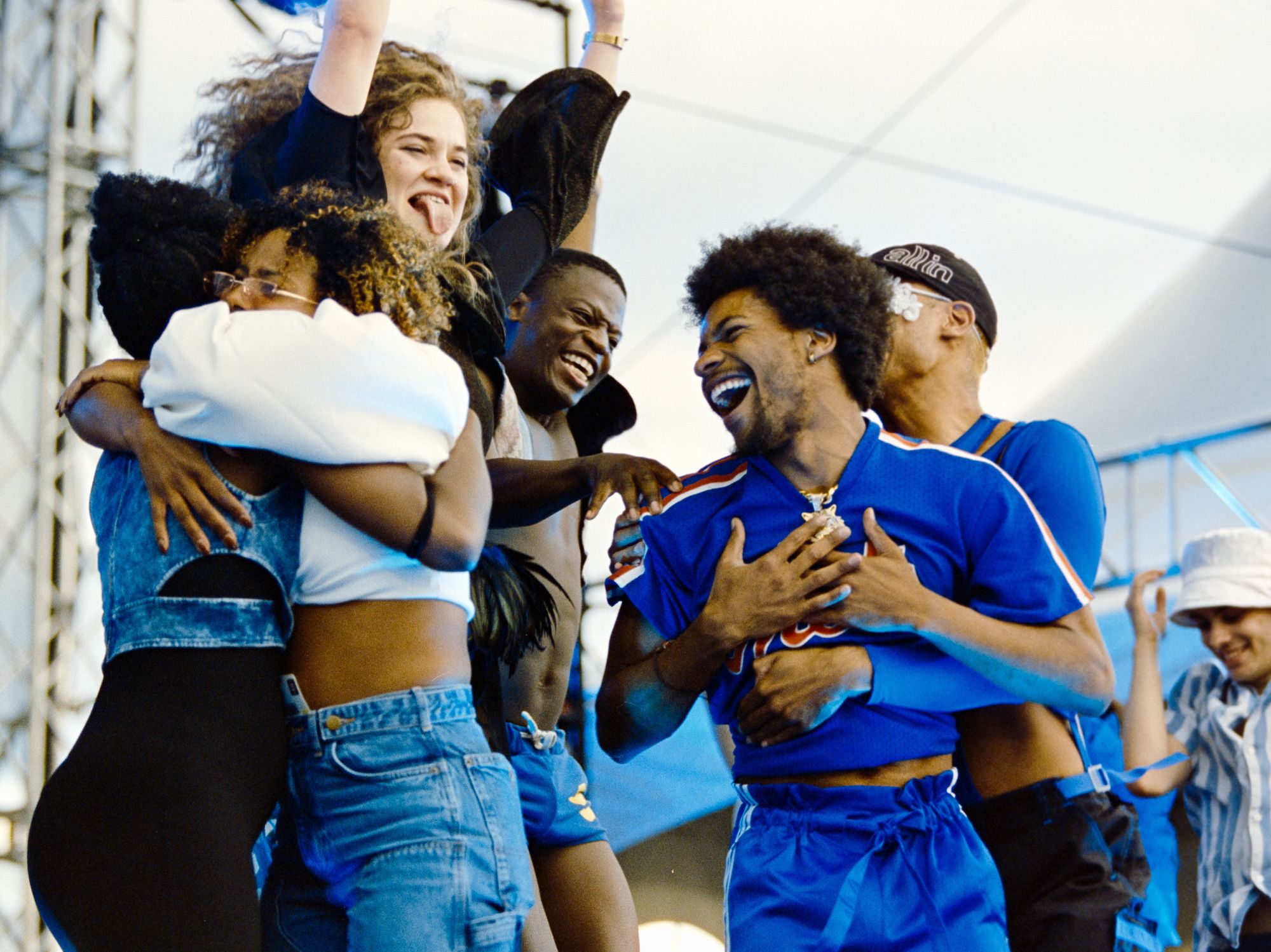 \u200bPerformers hug on stage at Montreal Pride.