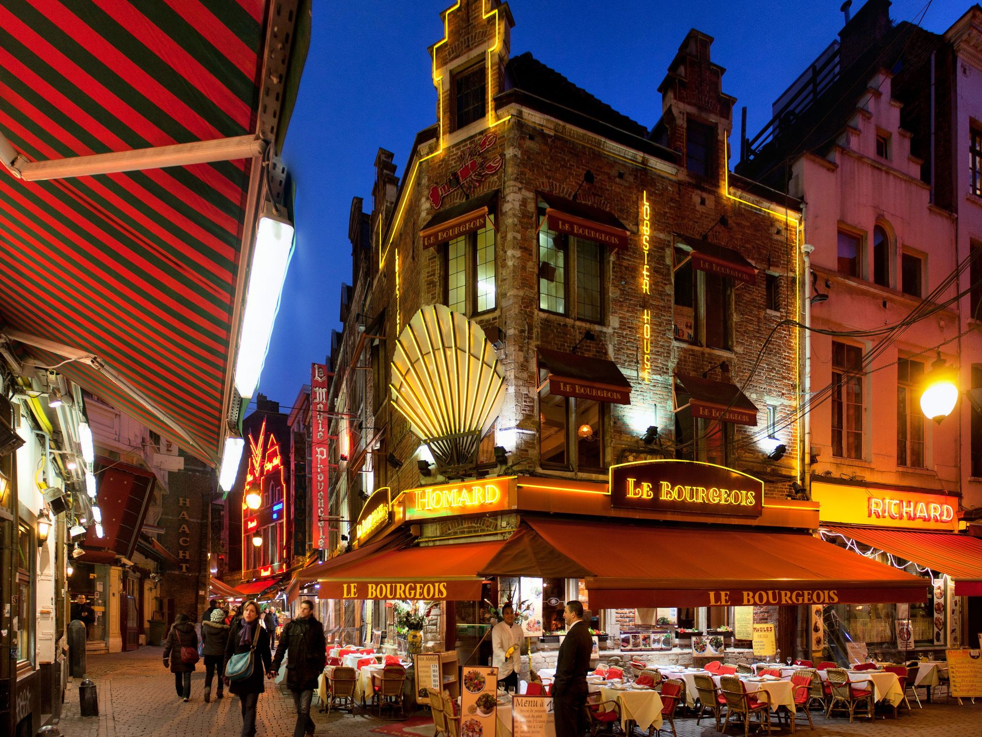 \u200bRestaurants in Brussels, Belgium, at night.