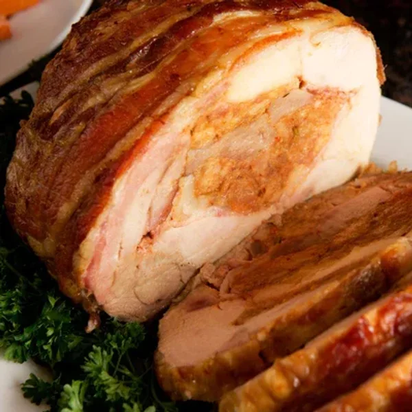 \u200bSliced turkey on a bed of parsley.