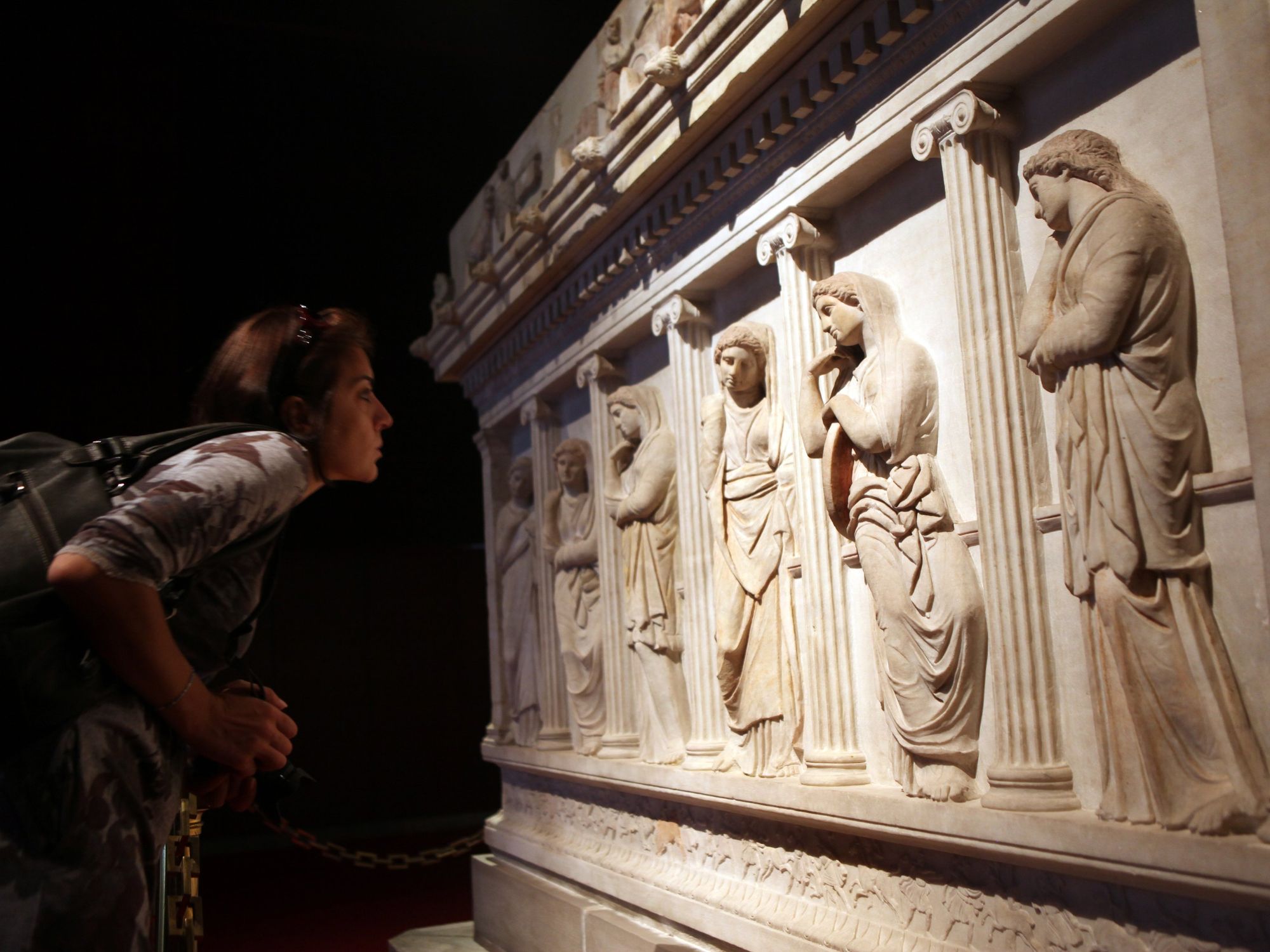 \u200bSomeone looks at an ancient carving at the Istanbul Archaeological Museum.