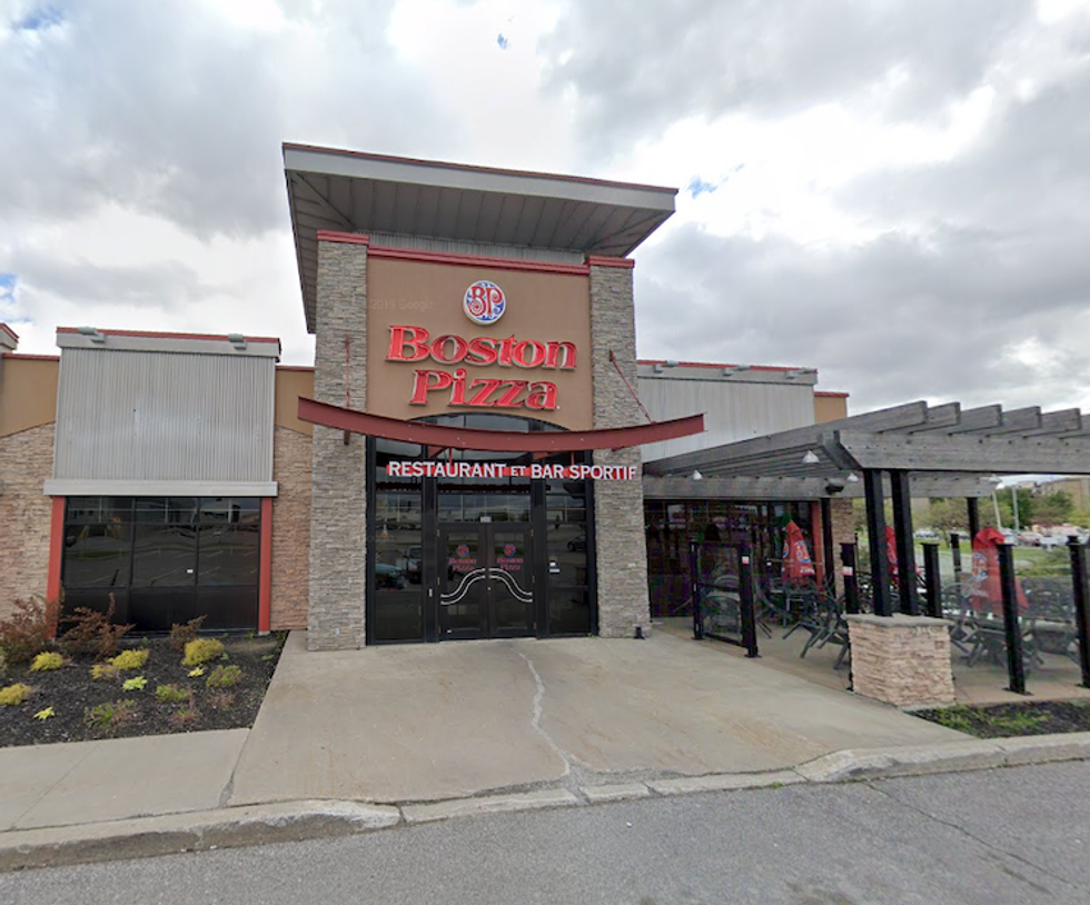 \u200bThe exterior of a Boston Pizza in Montreal.