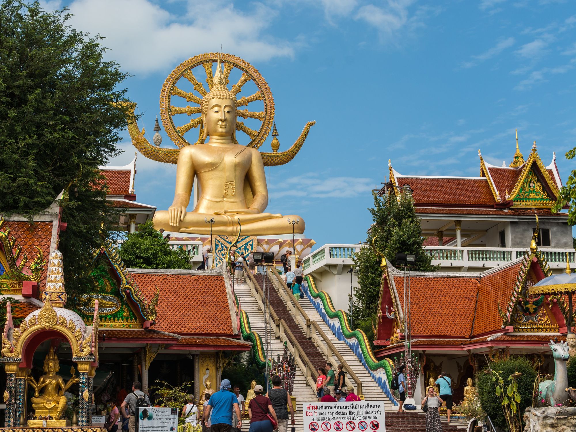 \u200bThe golden Buddha statue surrounded by tourists at one of the most famous landmarks in Koh Samui,Thailand.