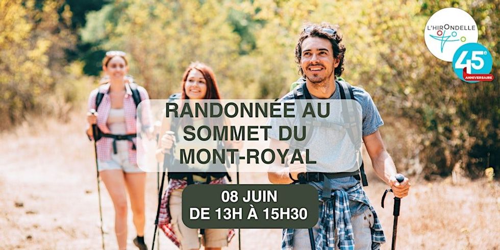 \u200bThree people with hiking gear walking up a mountain.