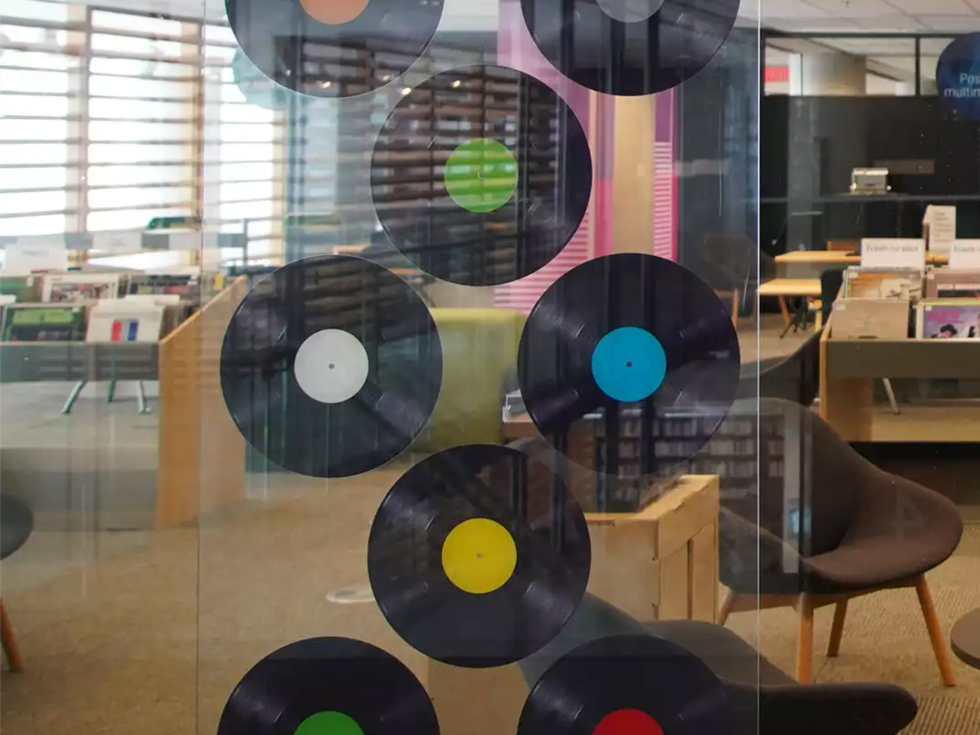 \u200bVinyl records in the window of the music pavilion.