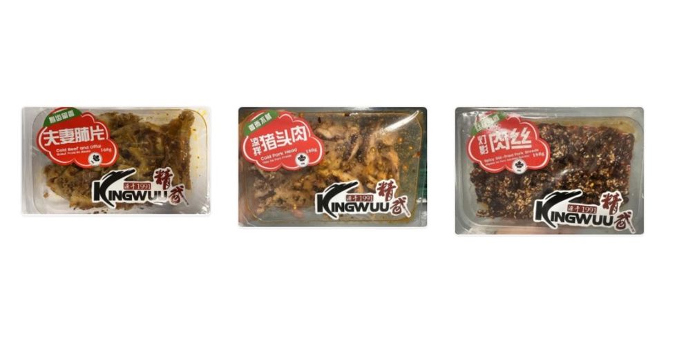 Various marinated meats in plastic packaging.