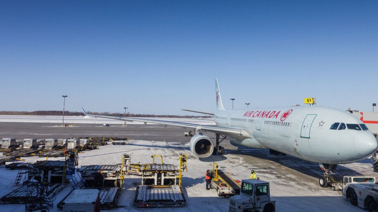 View from indoor of a plane of Air Canada almost ready for take-off.