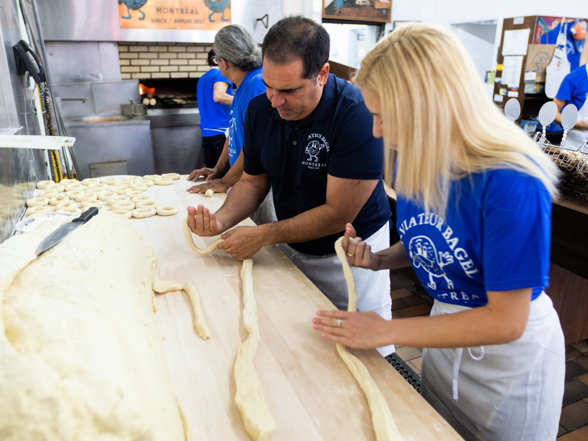 Wrapping the dough around the hand to get the size and shape right.