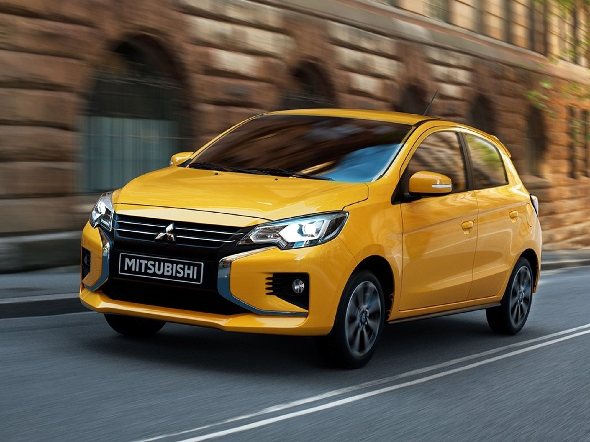 Yellow Mitsubishi Mirage.